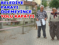 Belediye parayı ödemeyince yolu kapattı