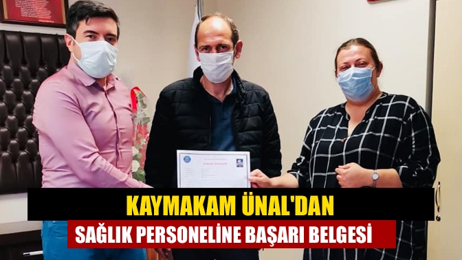 Kaymakam Ünaldan Sağlık personeline başarı belgesi