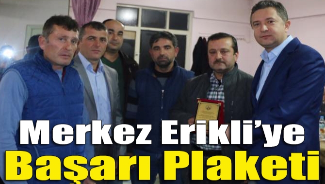 Merkez Erikli’ye başarı plaketi