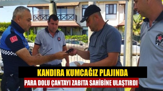 Kandıra Kumcağız plajında para dolu çantayı Zabıta sahibine ulaştırdı