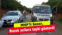 MHP’li Sezer, bozuk yollara tepki gösterdi